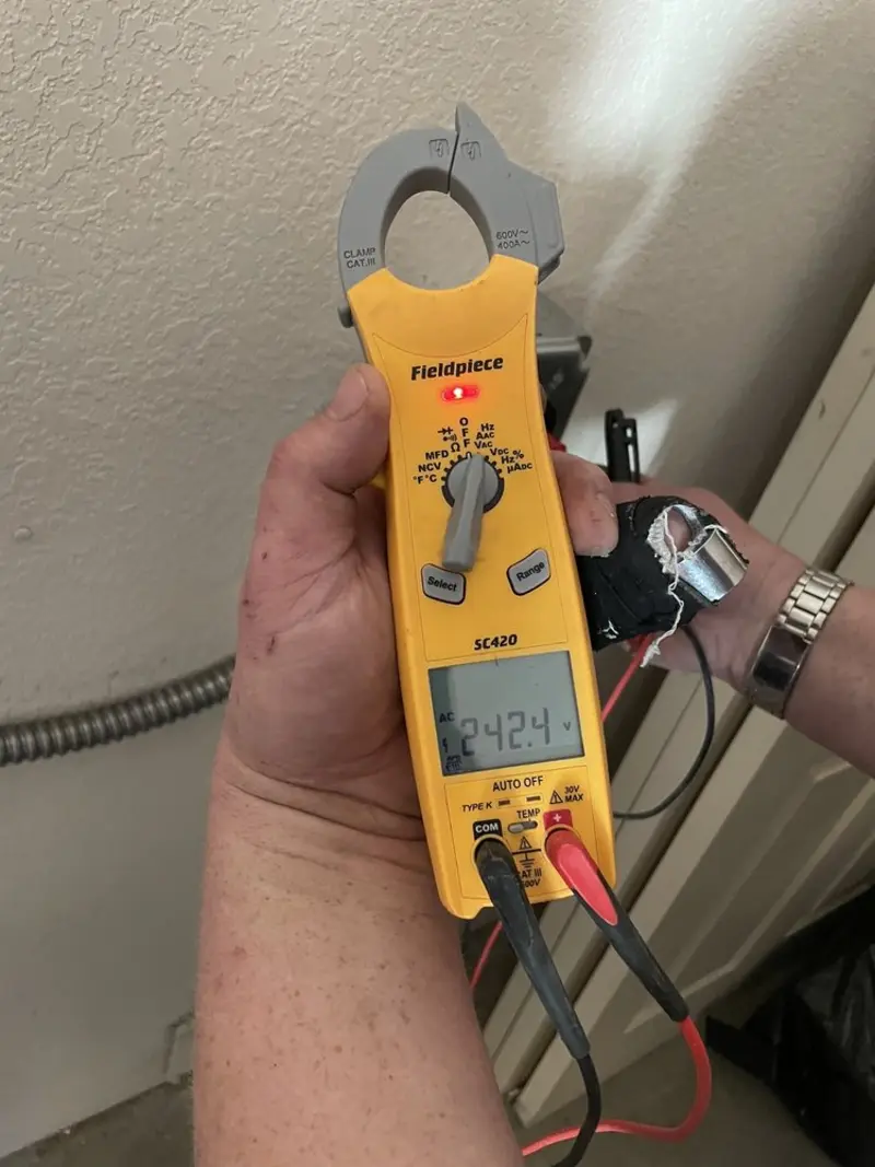 Voltage testing with clamp meter during Recessed Lighting Installation in West Peoria